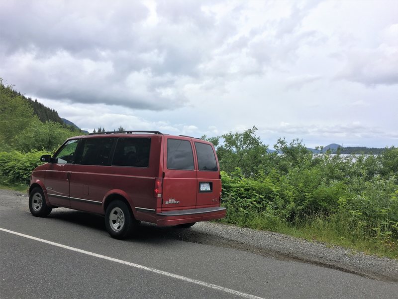 Red Safari van on side of the road on Vancouver Island